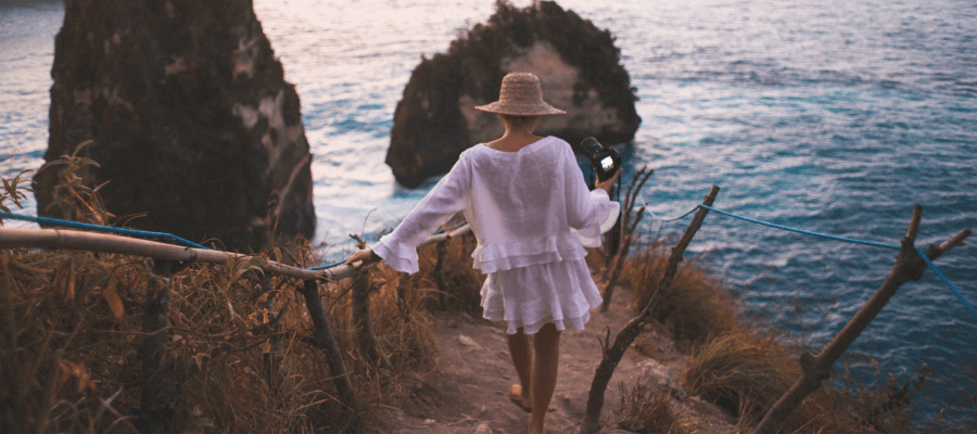 Photographer walking to the beach