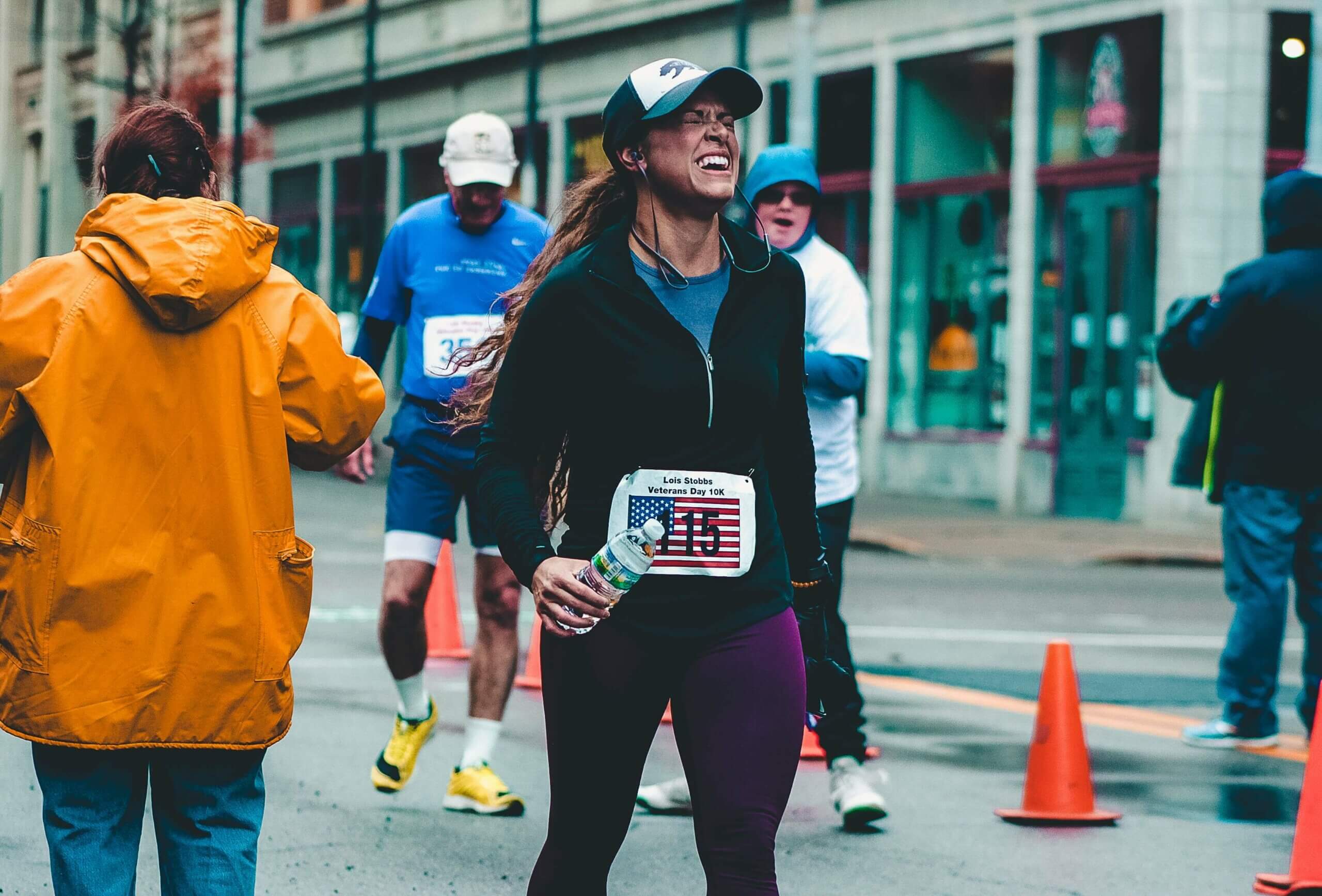 5 Tips for Setting Realistic Goals: How to Combat Workflow Fatigue Runner at finish line after setting realistic goals