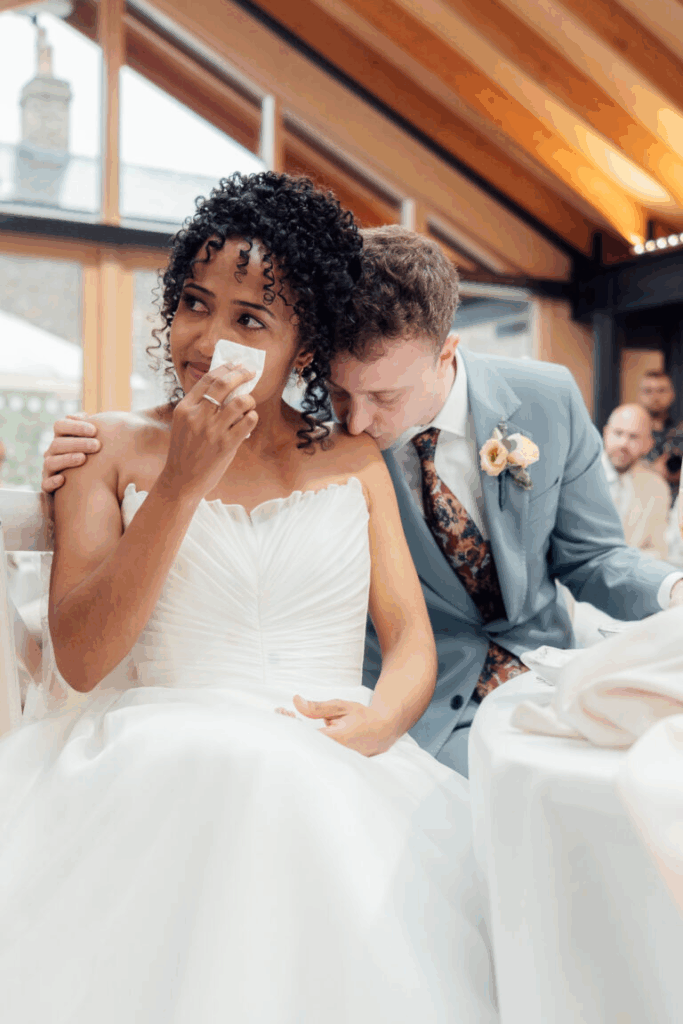 candid wedding portraits of the bride and groom sharing an emotional moment