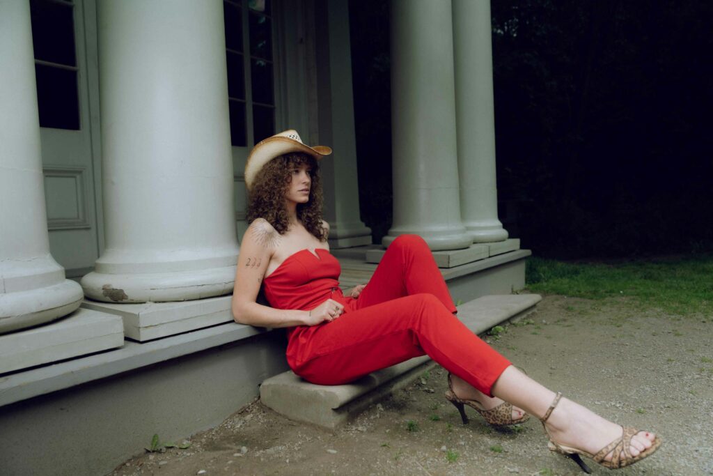 girl in red outfit in outdoor photoshoot