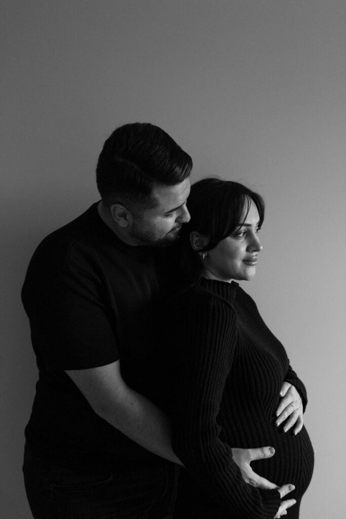 Both of you put your hands on the belly at the same time