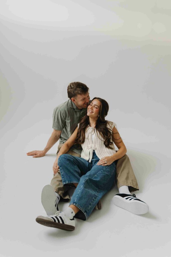 Sit between his legs and lean back