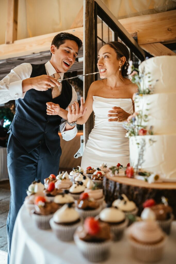 Groom feeding bride photo composition for documentary wedding photography
